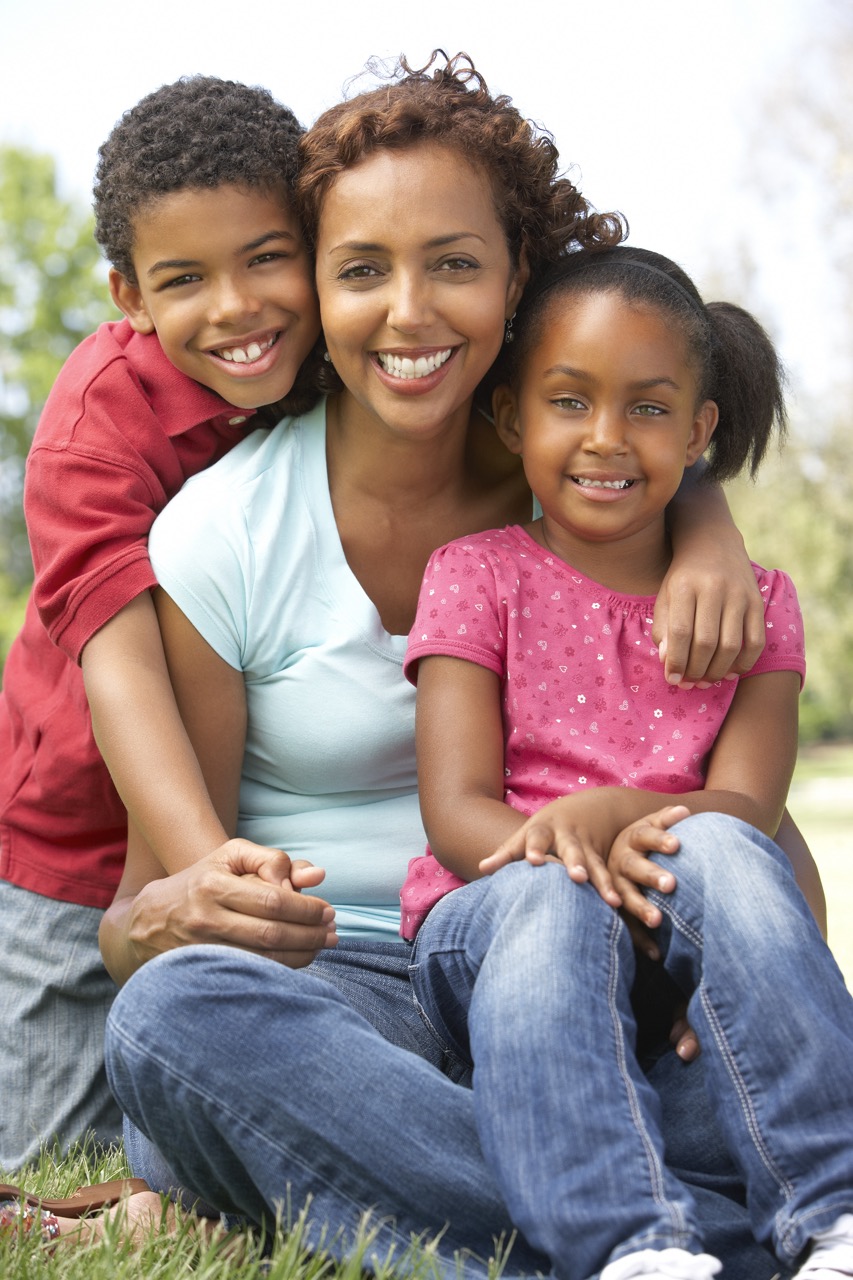 African American mother with a boy and a girl smiling